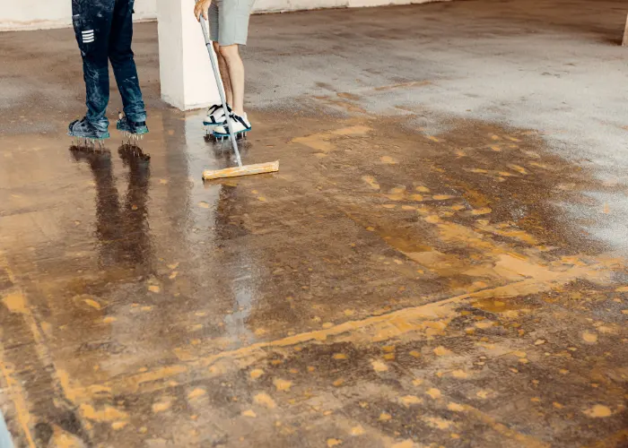 A polished concrete contractor cleaning & sealing a commercial concrete garage floor