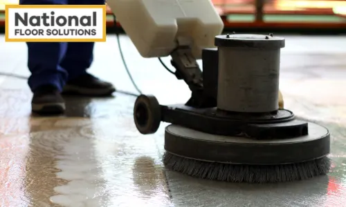 Concrete Sealing & Cleaning - Image is a man cleaning a concrete floor